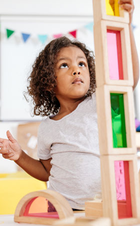 Girl building tower