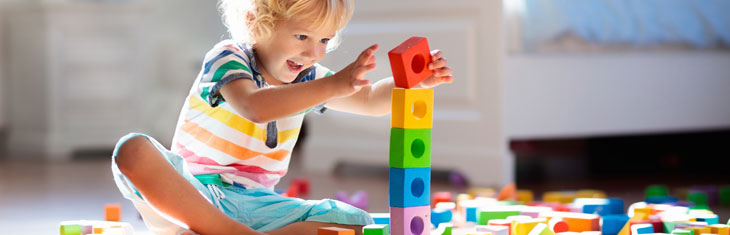 Child with building blocks