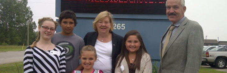 The Honourable Margaret Norrie McCain with Dr. Carl Corter and students from Hillside Elementary School on the Kettle and Stoney Point First Nations