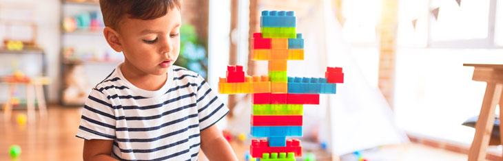 Child with building blocks