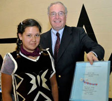 Student presents her original story to the Right Honourable Paul Martin.